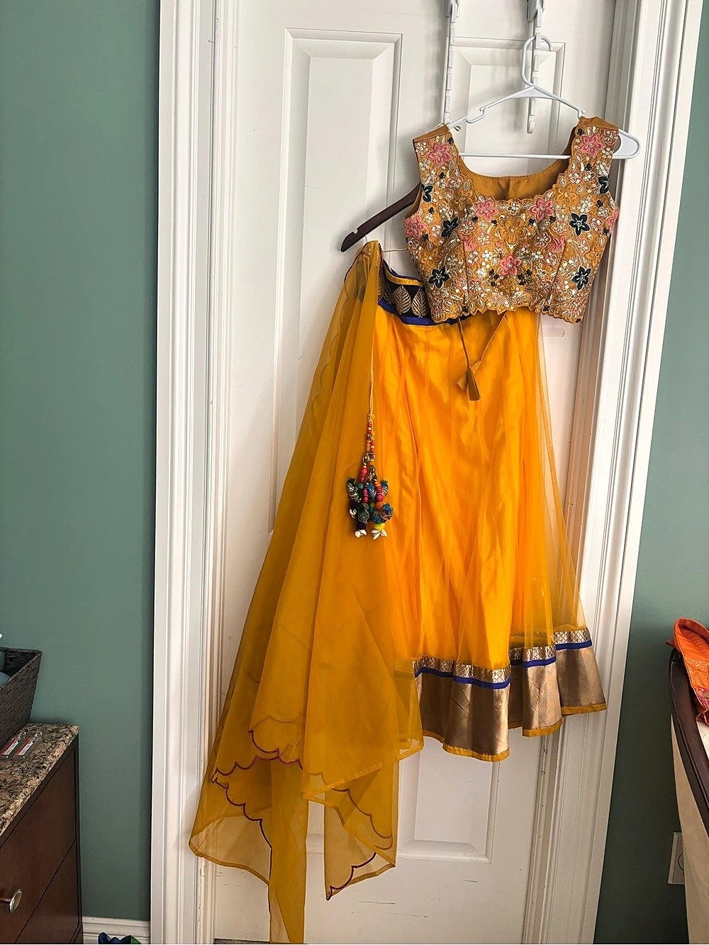 Floral Embroidered in golden yellow three piece Lehenga Size large. 38/40 bust